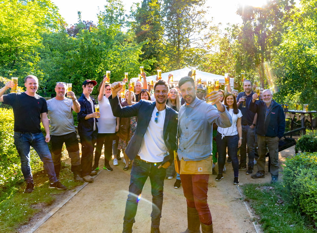 Peter Andre and volunteers toasting